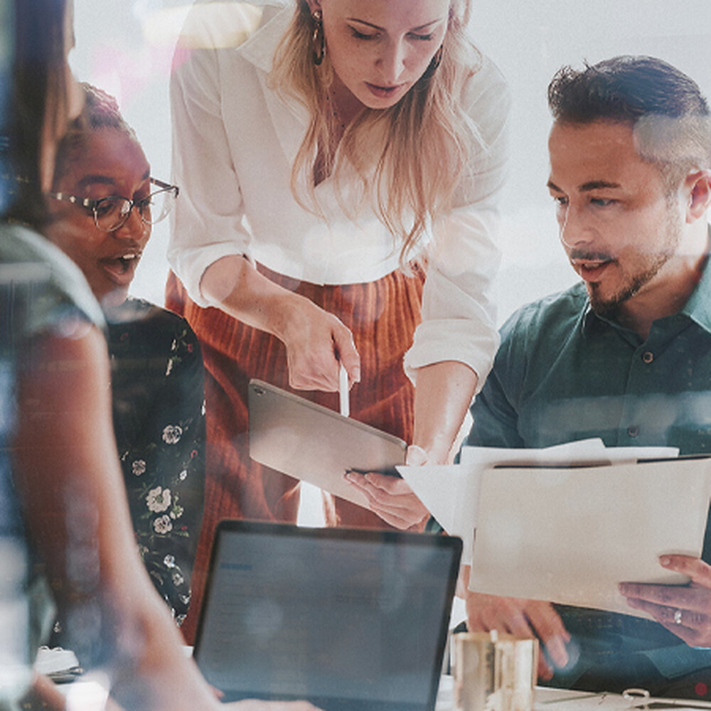 A partner team reviewing a client's benefits plan together